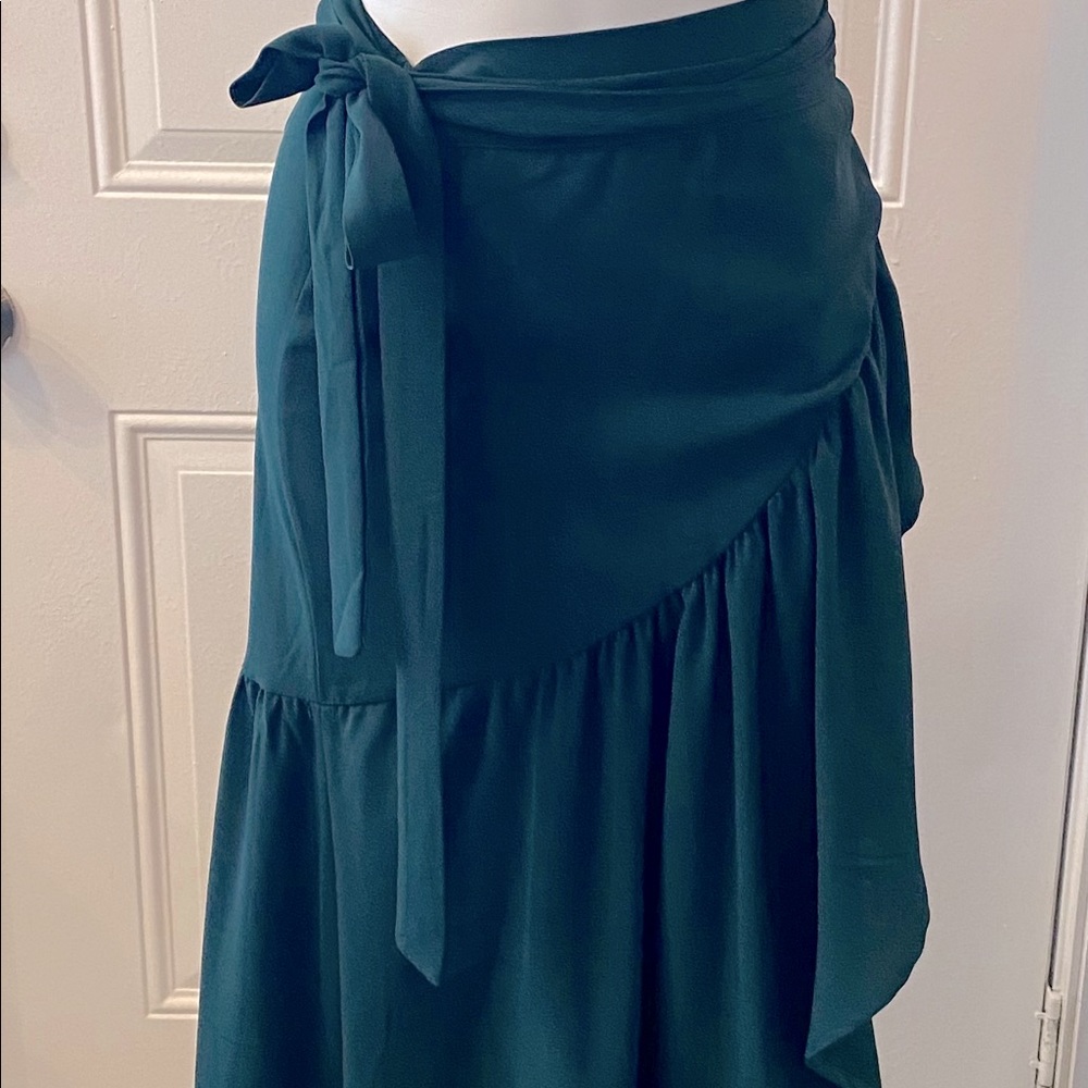 Wrap around long green skirt, adjustable waist.